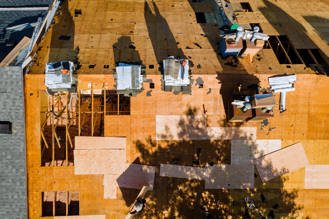 Roof replacement by workers